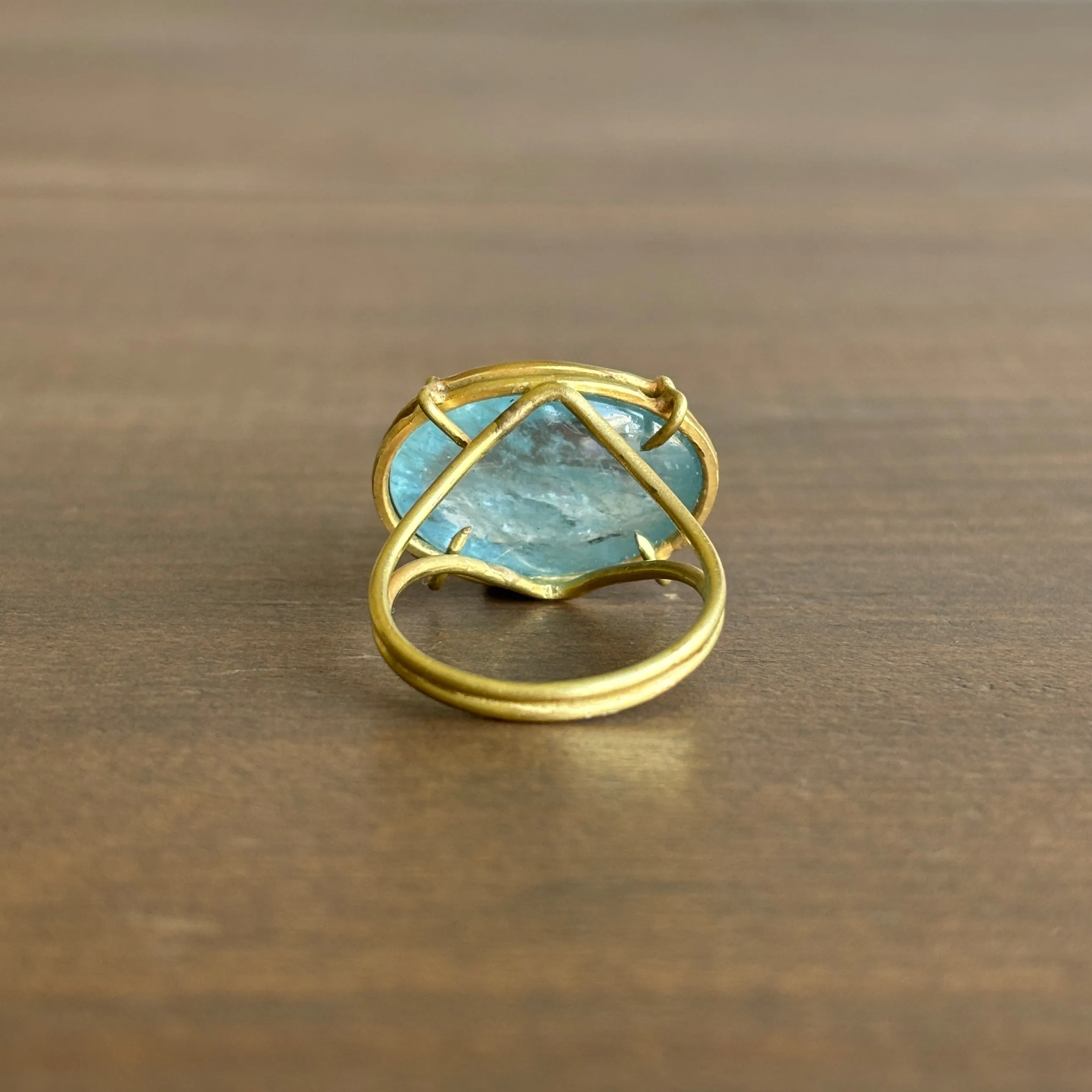 Oval Aquamarine Cabochon Cage Set Ring